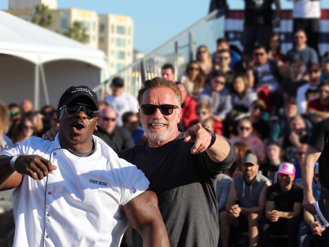 Chef Andre Rush on stage at a fitness expo