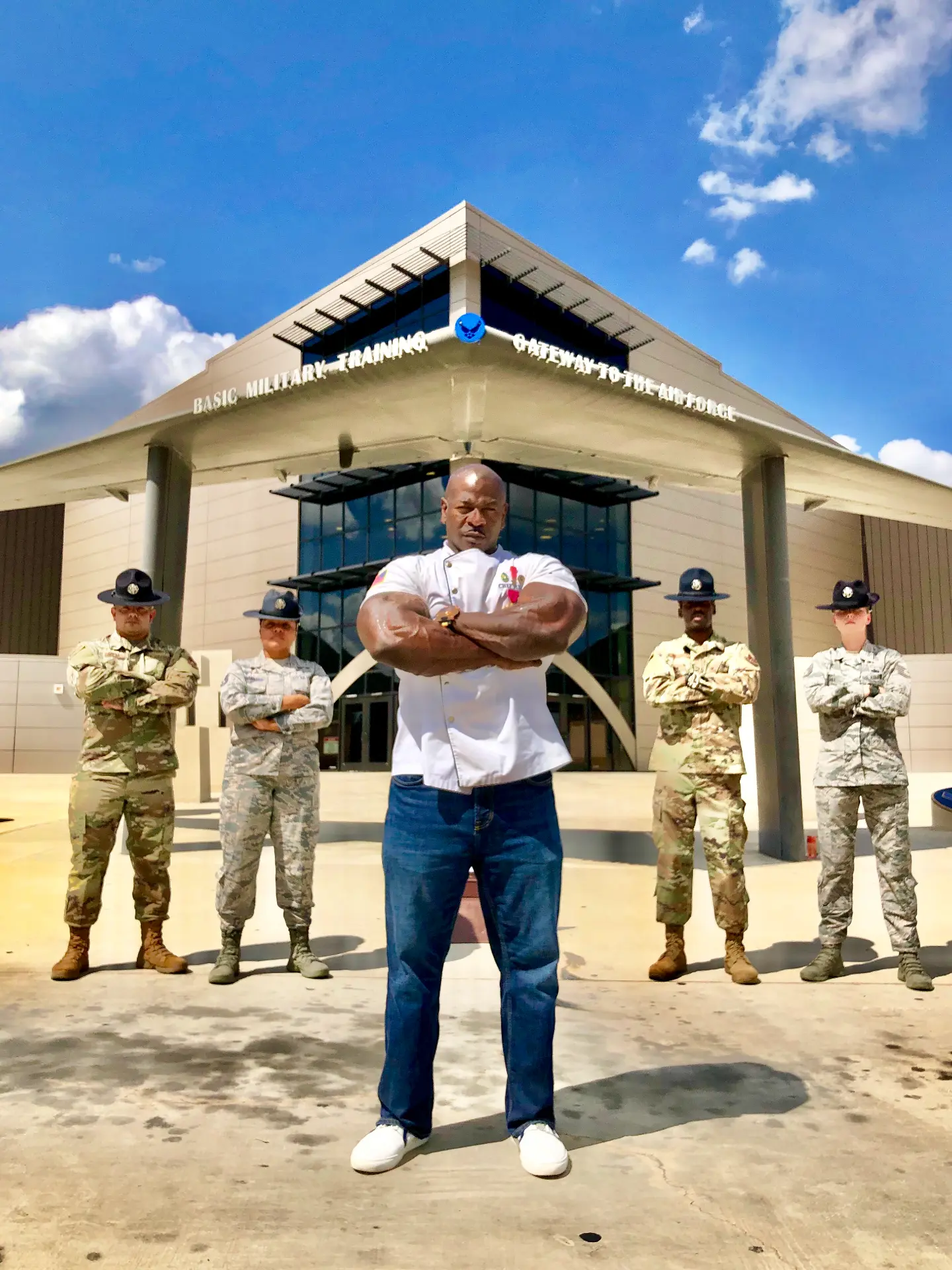 Chef Andre Rush with military training instructors outside Basic Military Training